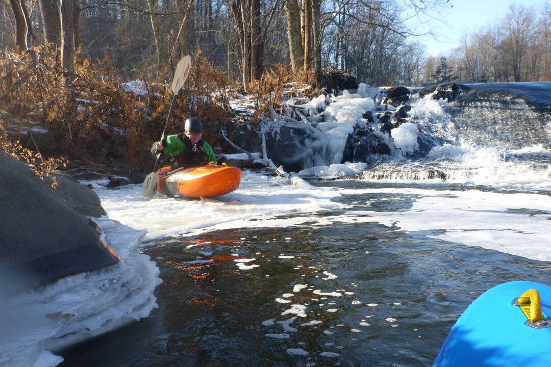 Tom Pushing across the ice to get back to the river.